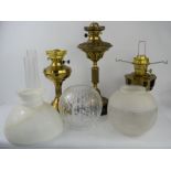 Three Victorian and later paraffin lamps with glass shades. A/F