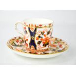 A 19th century Coalport porcelain cup and saucer, in the Imari pattern, saucer 14cm diameter.