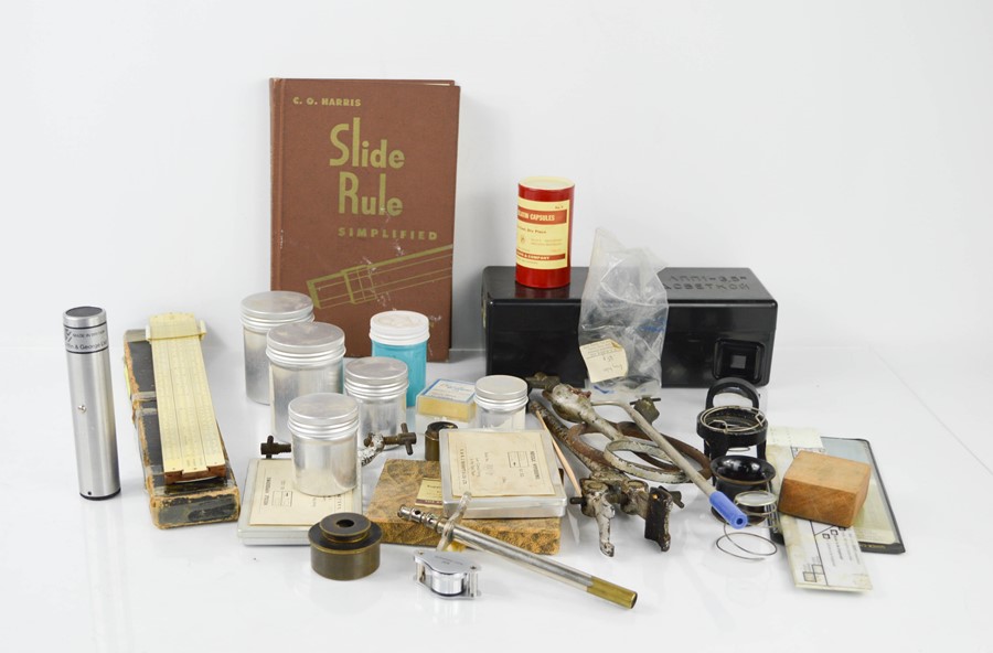 A group of chemists collectables to include eye glasses, magnifying glasses, boxed slide rule.