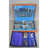 A Viners cased canteen of cutlery and a boxed set of silverplate spoons