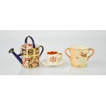 A Royal Crown Derby watering can, a Royal Worcester miniature twin handled cup painted with birds on
