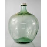 A large glass terranium / green glass jar and cover.