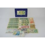 A quantity of vintage banknotes to include - One pound notes - Ten shillings - Five pounds - China