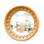 A giltwood porthole mirror with beaded border, and convex mirror.