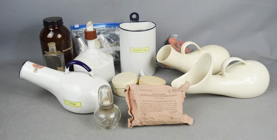 A group of chemists collectables to include enamel urinal, douche can and pipe, ceramic urinals