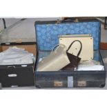 A quantity of vintage linen together with a vintage suitcase and two handbags