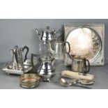 A group of silver plate ware to include teapots, wine coaster and other items.