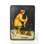 A Russian black lacquered box, depicting a woman in the snow catching fish, 5 by 11 by 15cm.