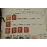 A stamp album containing early British and worldwide stamps to include a quantity of penny reds