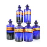 A group of six antique blue glass apothecary bottle, bearing latin labels, the tallest measures 24cm