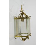 A brass, glass panelled hall lantern, 36cm high.