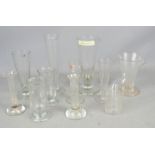 A group of glass measures, engraved, one by Tay Cop, the tallest 17cm high.