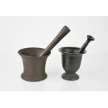 Two cast metal pestle and mortars, the largest 10cm by 12cm diameter.