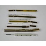 A selection of four vintage thermometers, with original steel cases, by various makers including