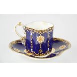 A fine 19th century Coalport porcelain demitasse cup and saucer, in cobalt blue with enamelled and