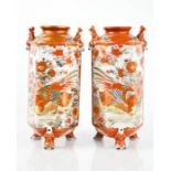 A pair of Kutani vases, decorated with birds, 25cm high.