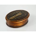 A treen trinket box embossed with golf club group, of oval form. [Being sold for our yearly