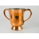 An antique copper tankard with twin handles, stamped to the base with makers mark, Askew of