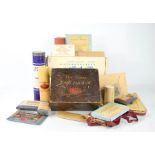 A group of vintage chemists accessories to include first aid box, umbilical and other bandages,