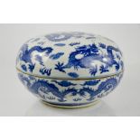 A Chinese blue and white porcelain box and cover, depicting dragons.