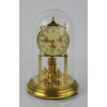A vintage Kieninger & Obergfell clock with glass dome