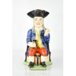 An early 19th century toby jug, 30cm high.