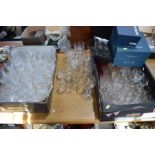A large quantity of crystal glasses of various shape and form to include some boxed examples