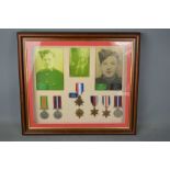 A framed WWII medal group to three members of the same family