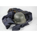 A WWII relic German type helmet shell together with a 1970/80s German Air Force tunic