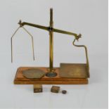 An antique De Grave Short & Co brass balance scales on stand