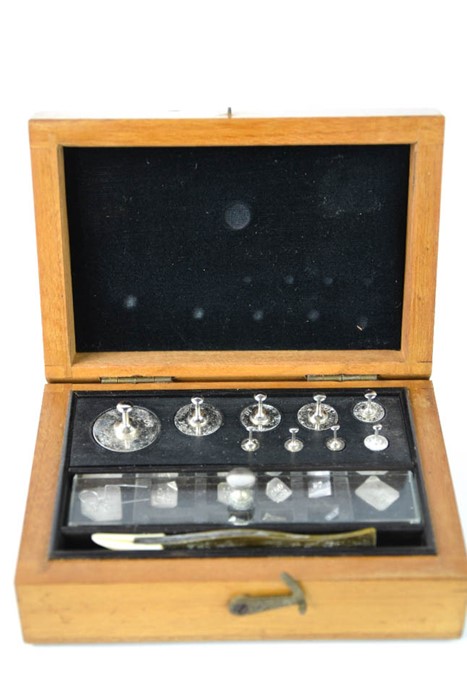 A set of vintage pharmaceutical weights, in the original box.