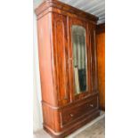 A Victorian mahogany wardrobe with two drawers to the base, 280 by 124 by 50cm.