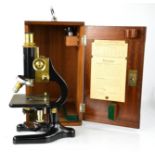 A Charles Perry boxed microscope.
