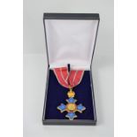 A replica CBE medal