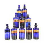 A group of ten antique blue glass apothecary bottle, bearing latin labels, the tallest measures 17cm