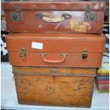 A vintage metal trunk together with two suitcase and contents of vintage linen and lace