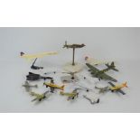 A group of Diecast model planes to include Corgi, Matchbox together with a brass Spitfire on a
