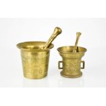 Two brass cast pestle & mortars, one engraved with animals, 8½ cm high.