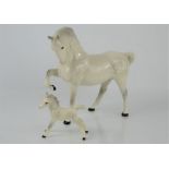 A Beswick prancing horse together with Royal Doulton example