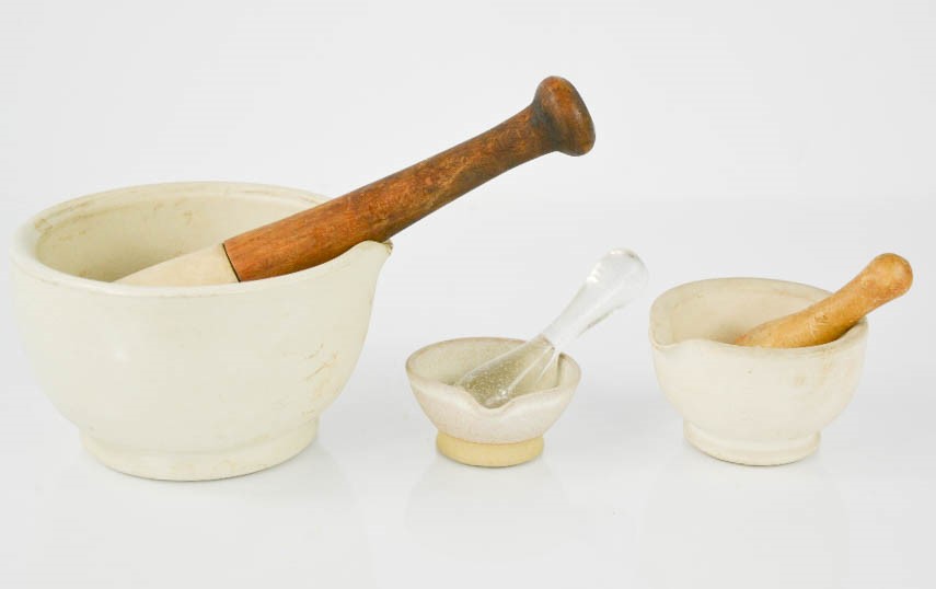 Three vintage pestle & mortars, two impressed to the bases, the largest measures 8cm high.