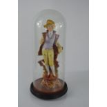 A glass dome with a ceramic figure in period dress a/f - 36cm