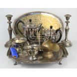 A quantity of silver plateware including a menorah, trays and a pair of candlesticks.