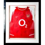 A signed Arsenal Shirt, framed and signed by the players, together with certificate of authenticity.