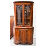 A mahogany glazed corner cupboard, with astrigal glazed cupboard doors, 181cm high, by 90cm wide.