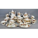 A Royal Albert "old country roses" part tea / dinner service to include tea / coffee pot , cups