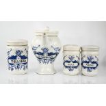 Three ceramic apothecary jars and an apothecary jug and cover, each bearing painted contents