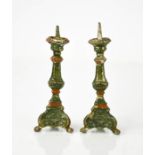 A pair of miniature cold painted lead pricket sticks, with residual green and red paintwork, 10cm