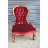 A Victorian carved nursing chair