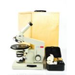 A Biolam microscope with case.