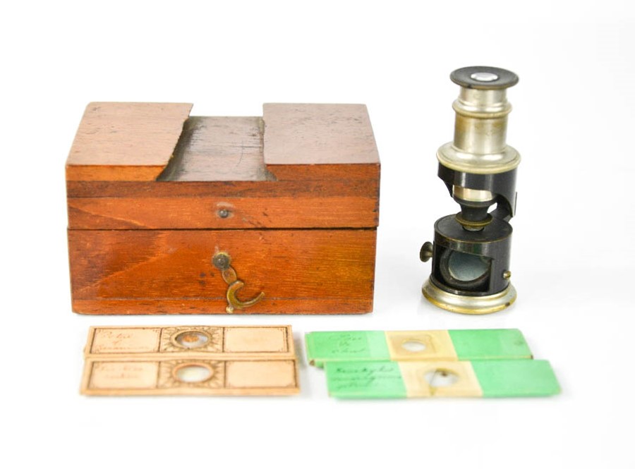 A pocket microscope by Thompson & Co Mathematical Instrument Makers of Liverpool, with four slides